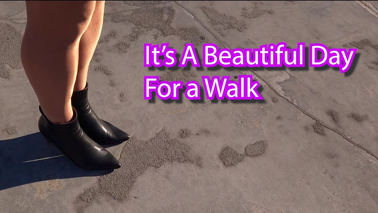 Genderqueer Xdresser walks around the parking garage in Shiny Tights and High Heels