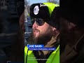 Watch: Crossing guard carries child across flooded street