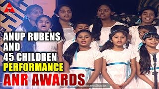 Anup Rubens and 45 Children Live  Perform Manam Movie Song at ANR Awards Resimi