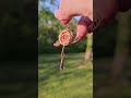 Rose pendant with glass bead. #handmadejewelry #copperart #wireweaving