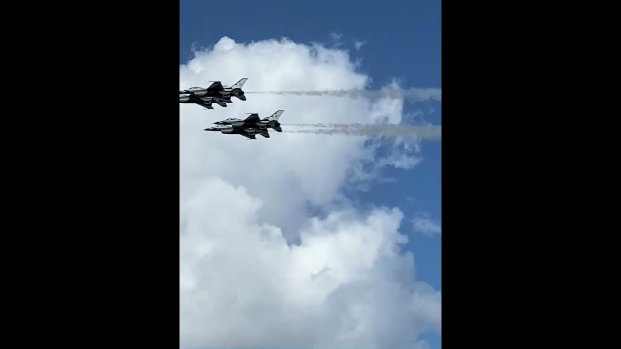 F16 Thunderbirds perform a very close flyby in front of crowd at