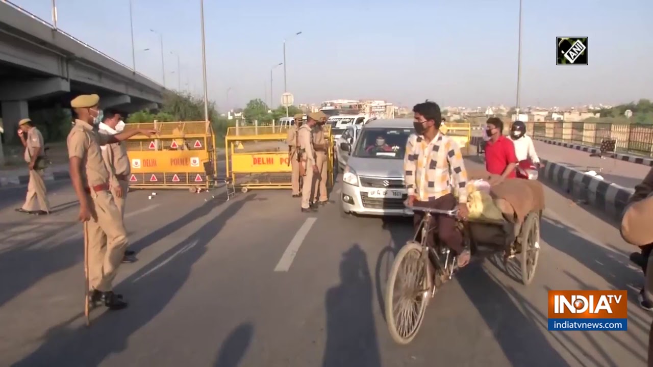 COVID-19 lockdown: Police personnel check passes, identity cards of people at Delhi-Ghaziabad borde