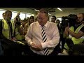 Mike Ashley pulls out a wad of £50 notes at a Sports Direct warehouse | 5 News