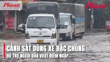 Cảnh sát dùng xe đặc chủng hỗ trợ người dân vượt điểm ngập | BaoPhuNuTPHCM