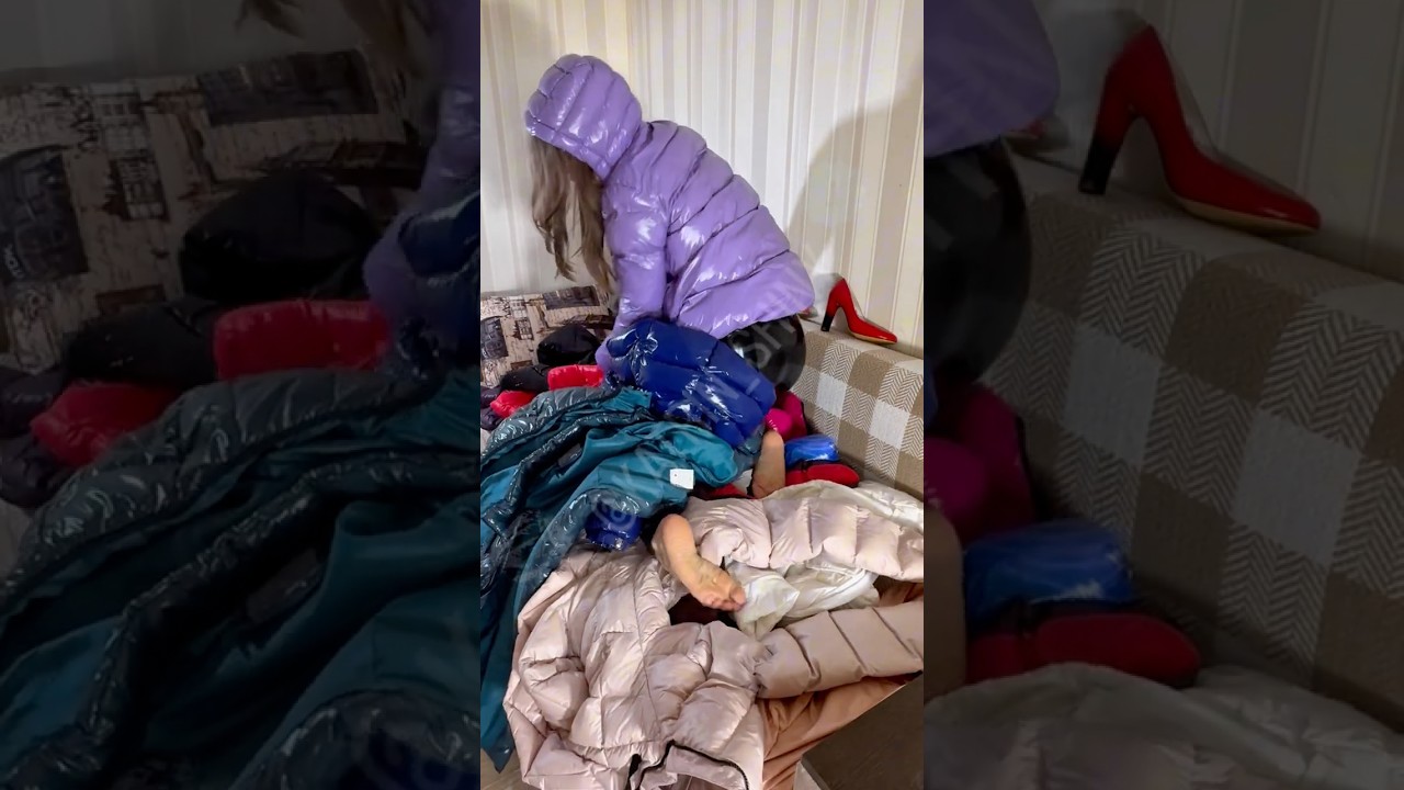 Gorgeous Girl in latex catsuit stuck buried under shiny nylon pvc raincoat jacket mess barefoot