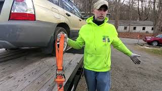 How to tie down a vehicle to a trailer.