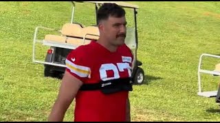 Travis Kelce given a warm welcome by Chiefs fans upon his arrival with mustache at the team's s seco