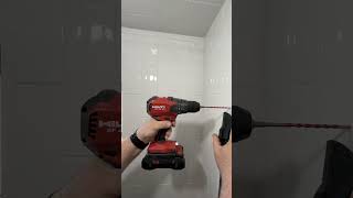 Hilti Nuron 22V drilling tile for a handheld shower head #plumbing #bathroomdesign #hiltinuron