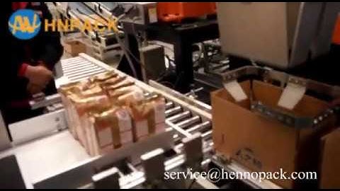 Hennopack robotic case packer for milk pouch bag pick and place in box
