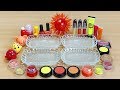 Fireboll Slime Mixing makeup and glitter into Clear Slime