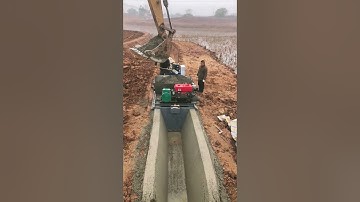 Construction of concrete irrigation canals- Good tools and machinery make work easy