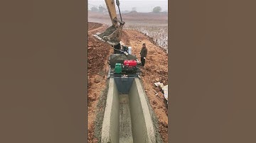 Construction of concrete irrigation canals- Good tools and machinery make work easy