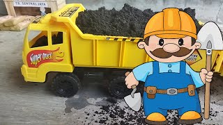 Mr. Dump Dump Mengangkut Bahan Bangunan Semen Pasir Batu Koral
