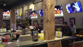 A group of fans at Buffalo Wild Wings in downtown Cleveland show their excitement over Jabrill Peppe