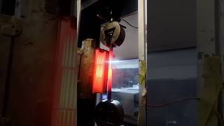 AT 1000 DEGREES CELSIUS PERFORMING TENSION TEST IN METALLURGICAL TESTING LABORATORY AS PER ASTM A370