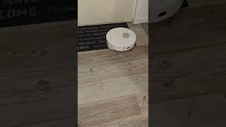 Dreame L10 Ultra robot vacuum cleaning a hallway