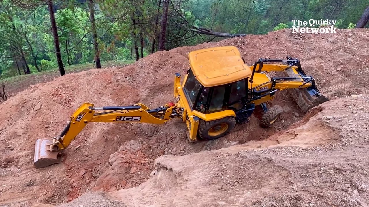 JCB Backhoe Widening a Mountain Road
