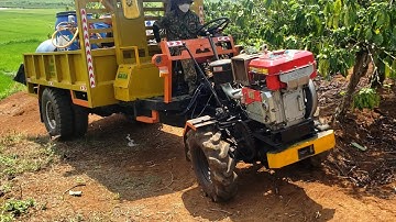 Xe công nông cầu đẩy của gara đông xuân màu vàng lốp đôi lên dốc rất khỏe...