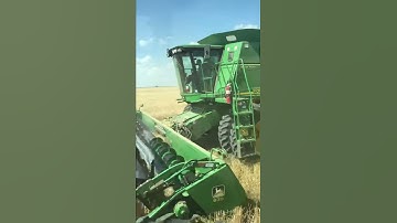 Here is a john Deere 9760 unloading onto a grain cart being pulled by a john Deere 4650