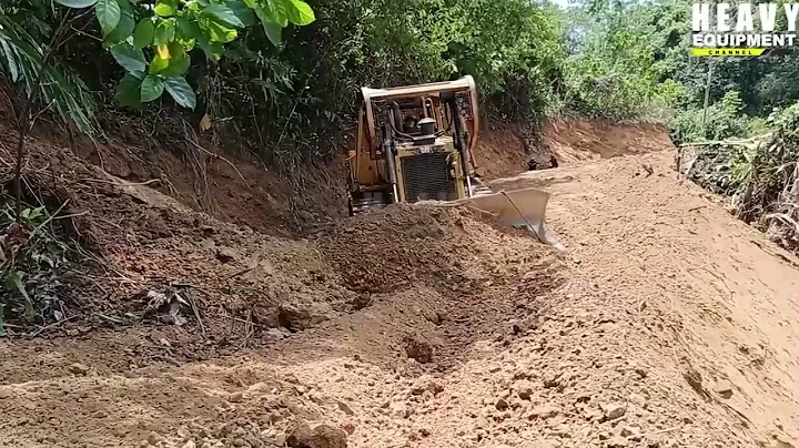 The operator of the Caterpillar D6R XL bulldozer is very skilled at working on new plantation roads