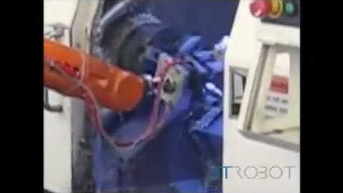 ABB IRB 1400 Robot Feeding Two CNC Lathes on a Prodcution Line