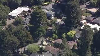 Chopper 5 over scene of bank robbery investigation, police raid in Oakland