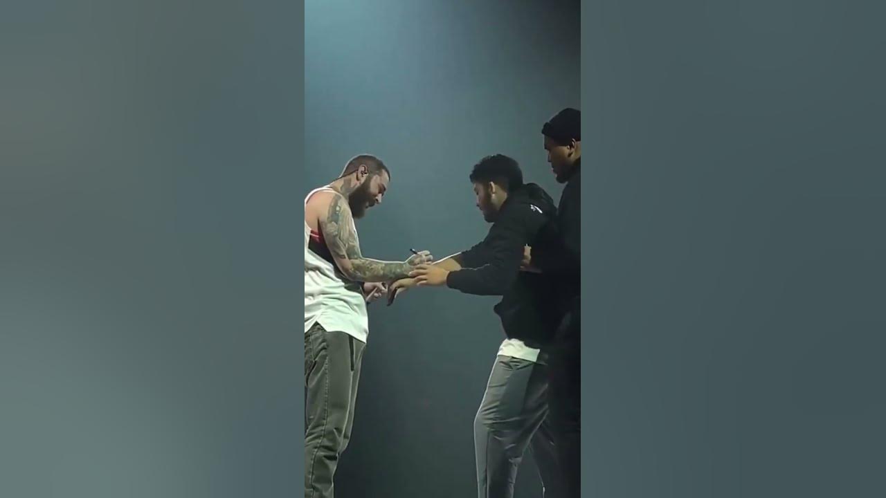 A Fan Runs Up On Post Malone At His Concert