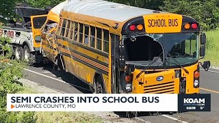 Semi crashes into school bus