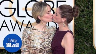 Sealed with a kiss! BFFs Sarah Paulson & Amanda Peet at Globes - Daily Mail