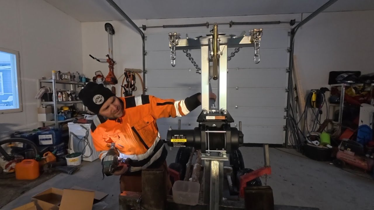 Puomin ja vinssin asennus mönkijän tukkikärryyn