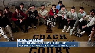 Basketball team dedicates title to coach they lost