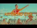 Replicate Wes Anderson color palette in the color grade.
