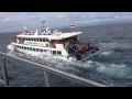 Phi Phi Island ferry full of people and water. (Original Footage)