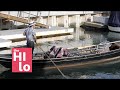 Gondoliers serenade Naples Island, despite business being closed