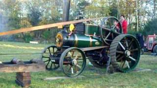 Fowler traction engine working hard driving a sawbench