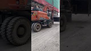 Use Excavator transport 1000 kg wooden barrel contains construction equipment remove out site