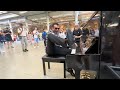 Elvis plays music with his foot at the public piano