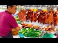 Try not to drool  amazing crispy pork belly  roasted duck chopping skills cambodian street food