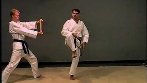 Board Breaking with a 180 jump reverse side kick