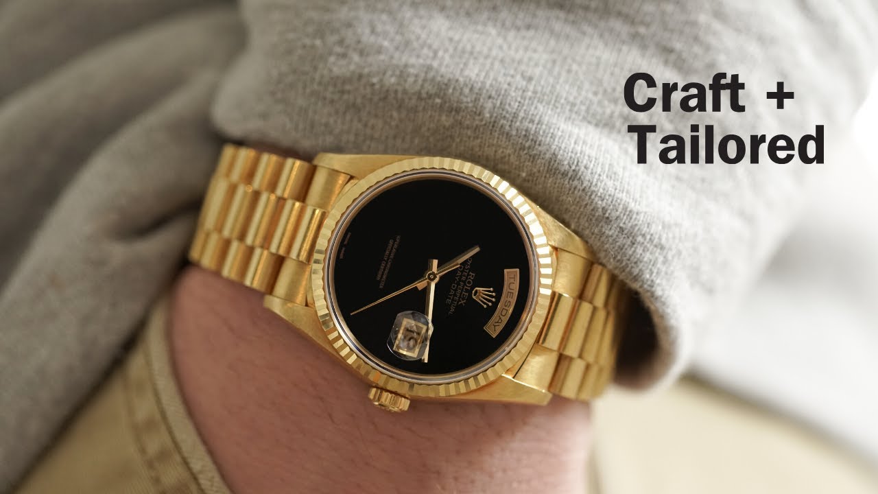 gold and silver rolex black face