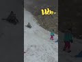Shia Sliding Down a Snowy Hill