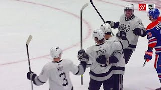 Adrian Kempe gets a deflection off Evan Bouchard for a goal.