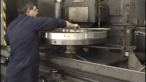 Roto grinding a large porous graphite vacuum spindle