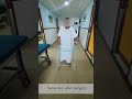 Patient walking with a walker same day after robotic knee replacement surgery by dr akhil arora