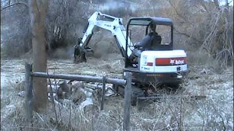 Bobcat E42 Excavator Moving Logs