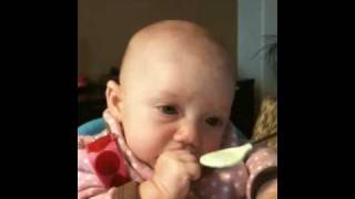 Ella eats rice cereal for first time