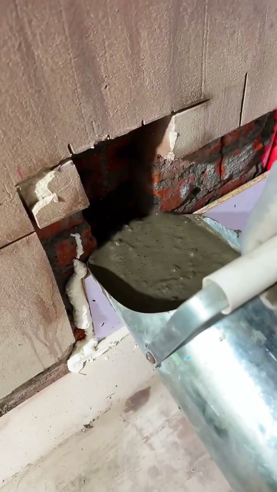 The tile laying process in the corner