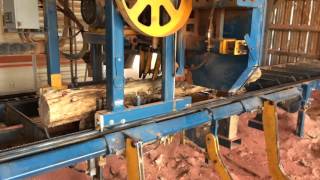 Baker 3630E sawmill sawing a small cedar log