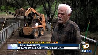 Homeowners clean up after massive storm