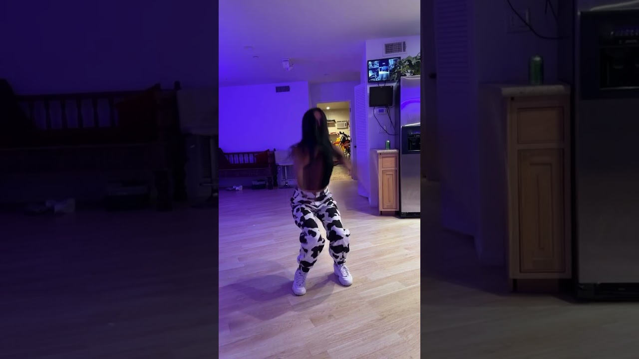 Girl wearing cow print pants does backflip then falls forward and faceplants on floor